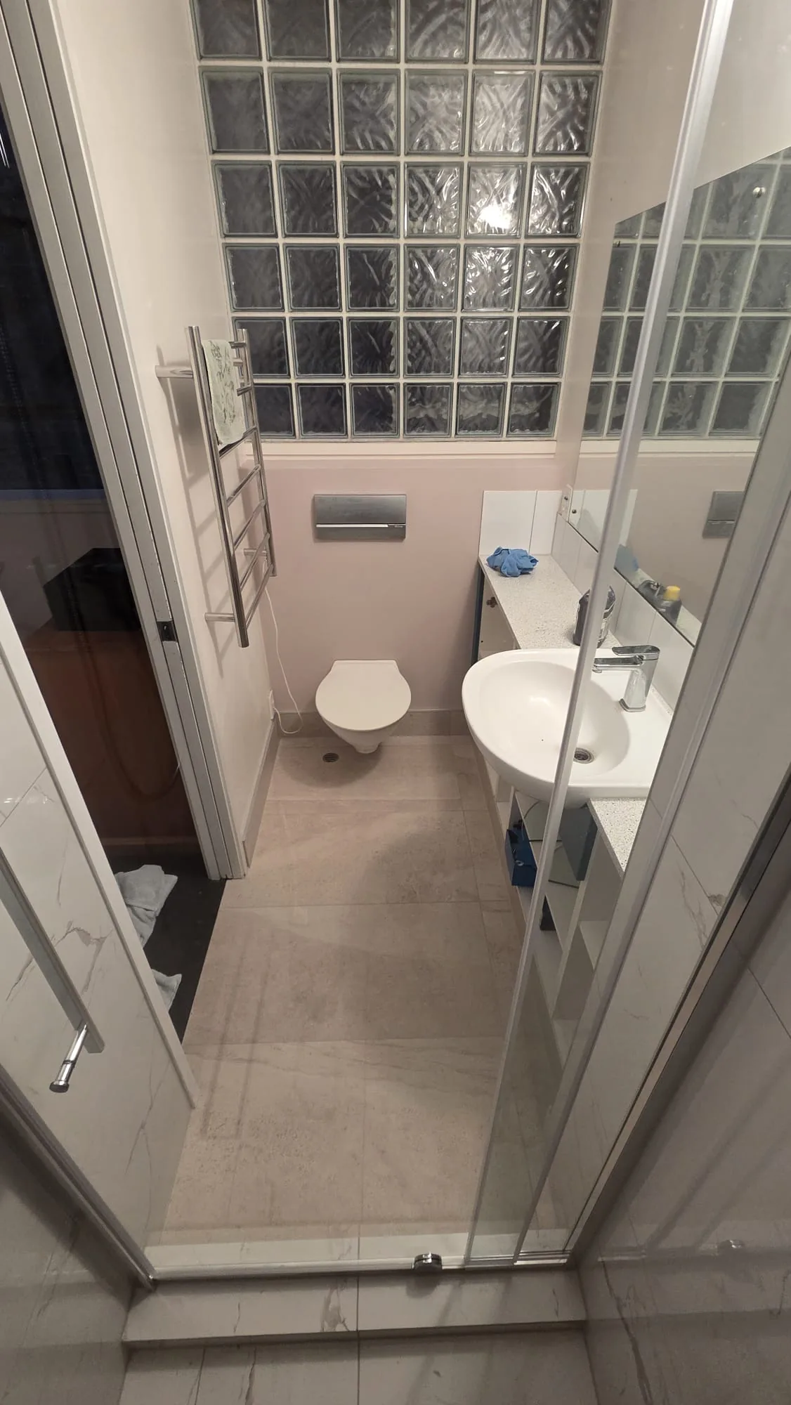 Renovated Parnell bathroom with marble-look wall and floor tiling, Central Auckland — by Tarara Tiling