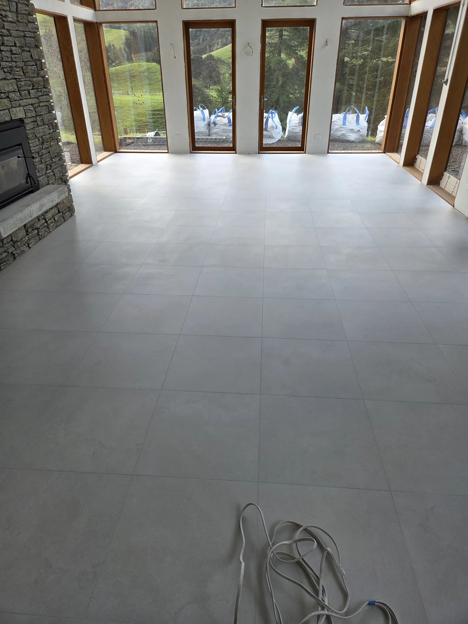 Large-format floor tiling across a Clevedon new build by Tarara Tiling