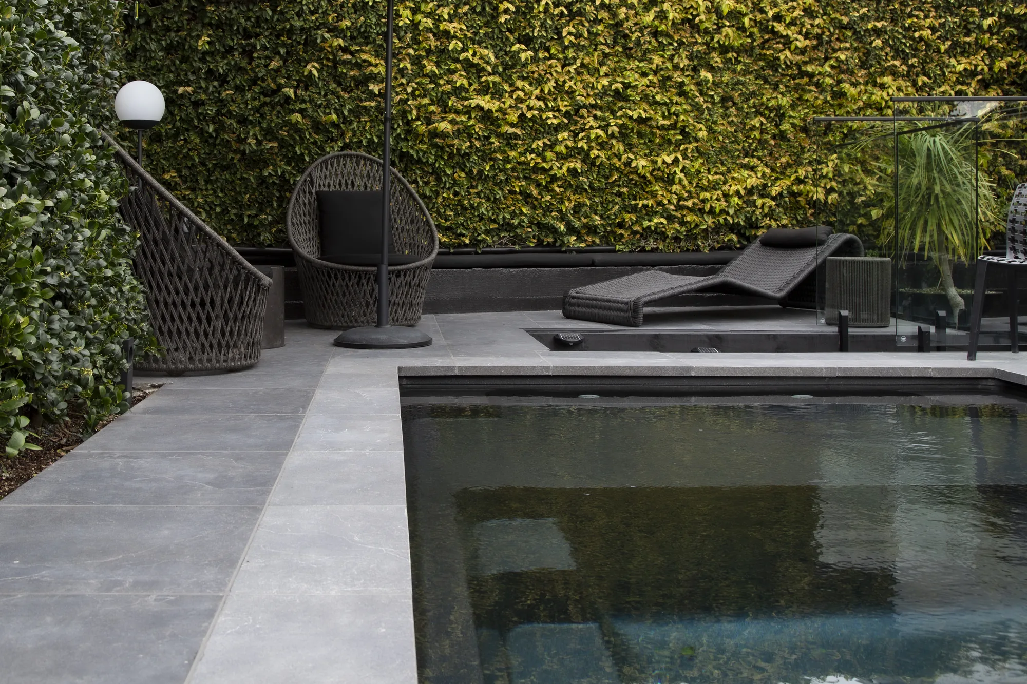 Tiled outdoor courtyard and steps in the Pt Chevalier designer project, Auckland — tiling by Tarara Tiling