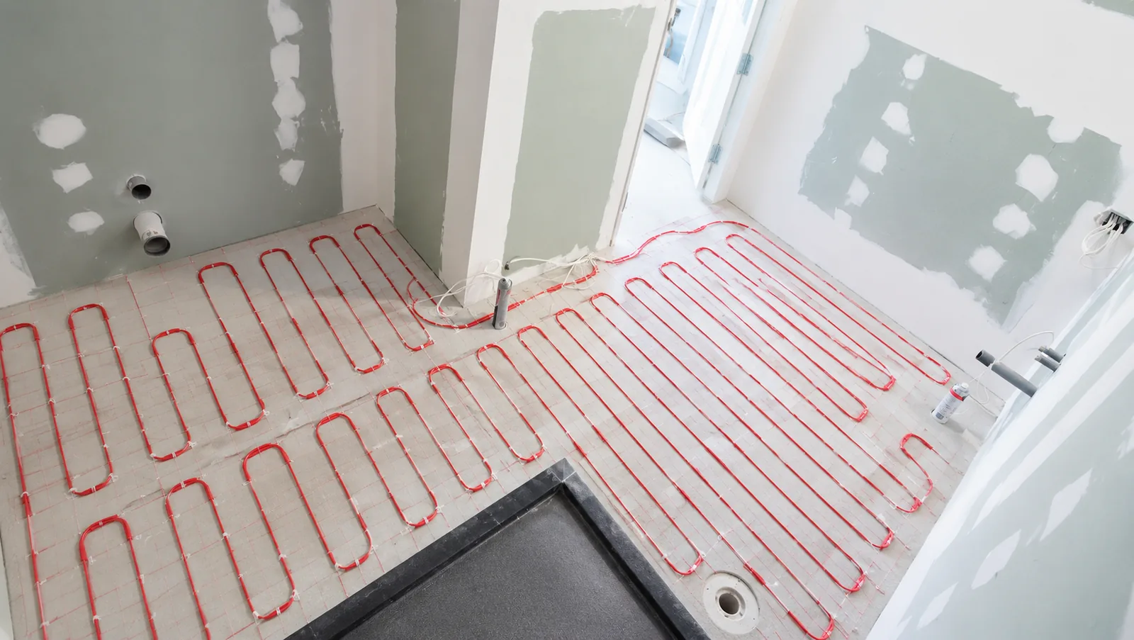 Underfloor heating installation under a tiled floor, Auckland